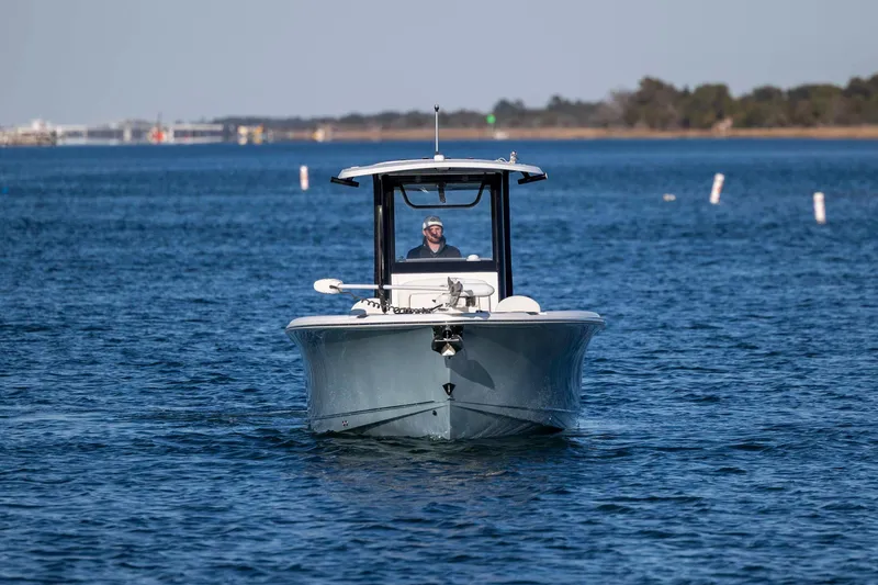 Slide: The Image of 2021 Sea Hunt Ultra 265 SE boat cruising on open water. - 7