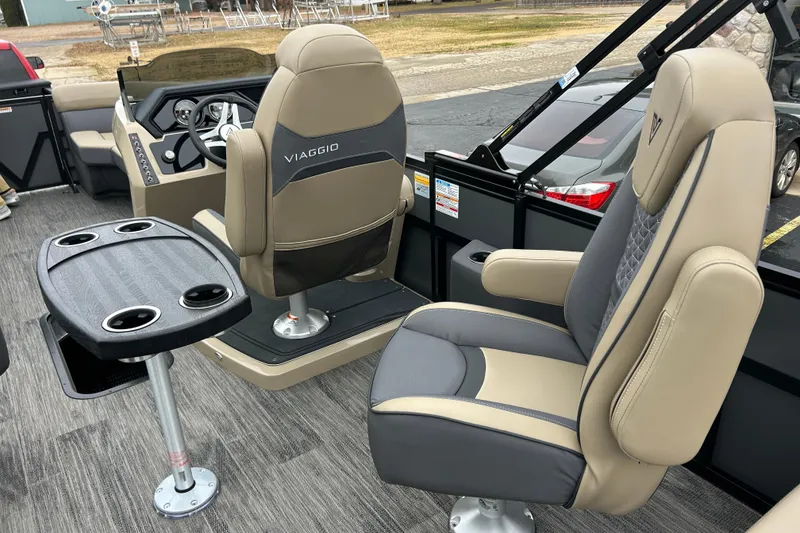 Slide: The Image of Interior of 2026 Viaggio Lago Z-Q boat with luxurious seating and cup holders. - 15