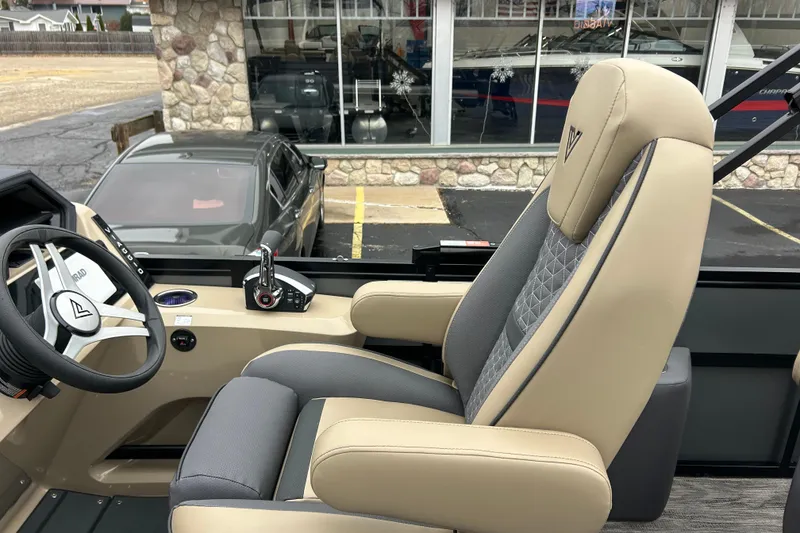 Slide: The Image of Captain's seat and steering of 2026 Viaggio Lago Z-Q boat, featuring modern design and controls. - 16