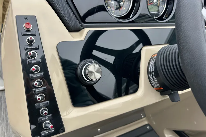 Slide: The Image of Control panel of 2026 Viaggio Lago Z-Q boat with switches and audio knob. - 18