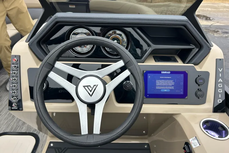 Slide: The Image of Steering console of 2026 Viaggio Lago Z-Q boat with digital display and controls. - 21