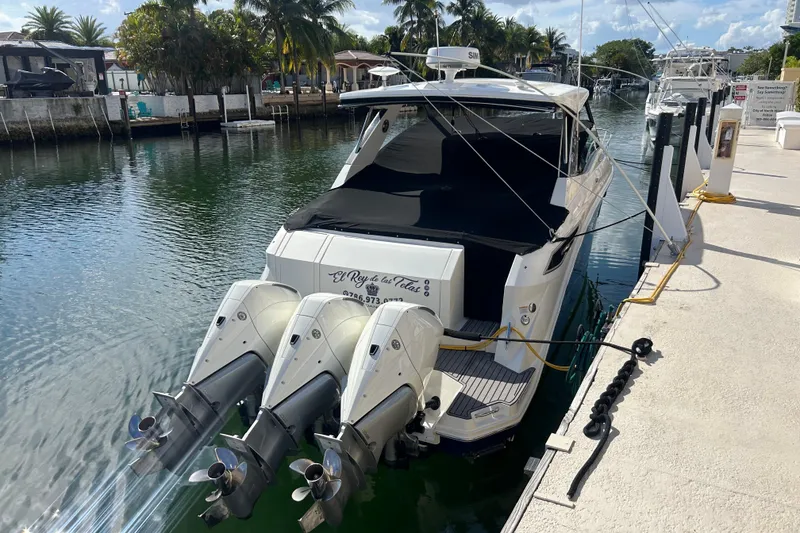The Image of 2022 Sea Ray Sundancer 320 Outboard docked, featuring spacious deck and dual engines. - 0
