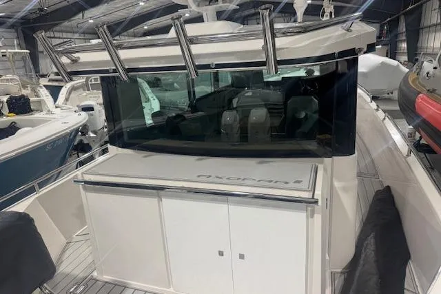 Slide: The Image of 2019 Axopar 37 XC Cross Cabin boat in indoor storage facility. - 4
