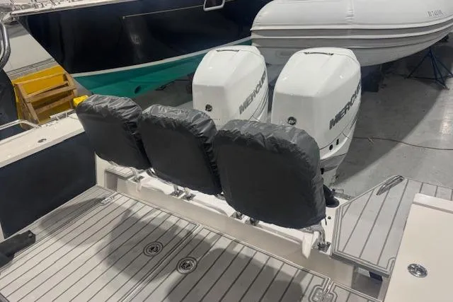 Slide: The Image of 2019 Axopar 37 XC Cross Cabin with dual Mercury engines and covered seating. - 5