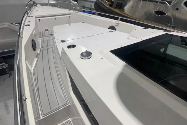 Slide: The Image of 2019 Axopar 37 XC Cross Cabin boat deck with sleek design and modern features. - 6