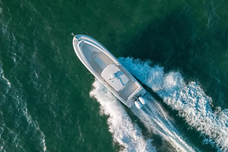 Slide: The Image of Aerial view of 2005 Hydra-Sports 3300 CC boat cruising on open water. - 12