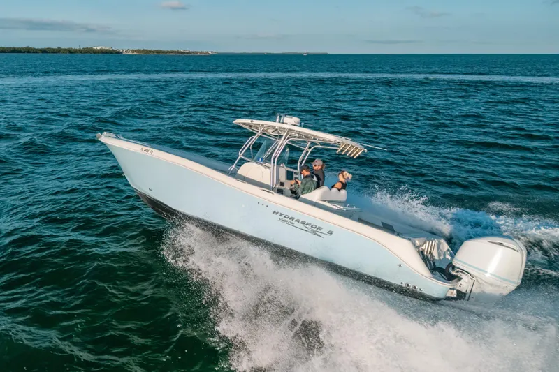 Slide: The Image of 2005 Hydra-Sports 3300 CC boat cruising on open water. - 14