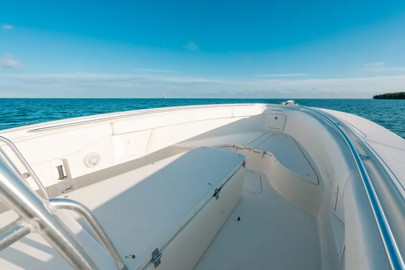 Slide: The Image of 2005 Hydra-Sports 3300 CC boat on open sea under clear blue sky. - 16