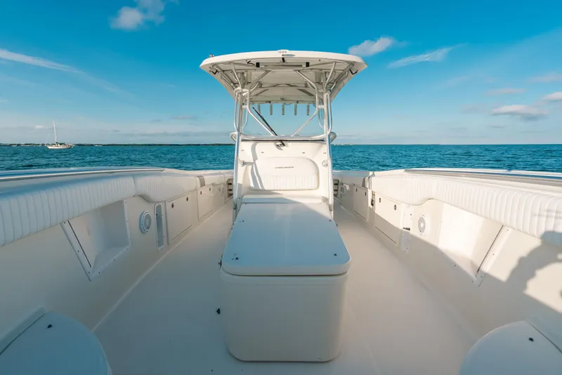 Slide: The Image of 2005 Hydra-Sports 3300 CC boat on open water under clear blue sky. - 18