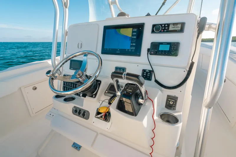 Slide: The Image of 2005 Hydra-Sports 3300 CC boat dashboard with navigation and control systems. - 19