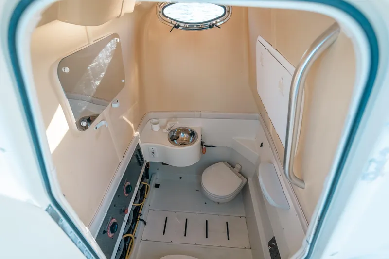 Slide: The Image of Interior of 2005 Hydra-Sports 3300 CC boat bathroom with sink and toilet. - 24