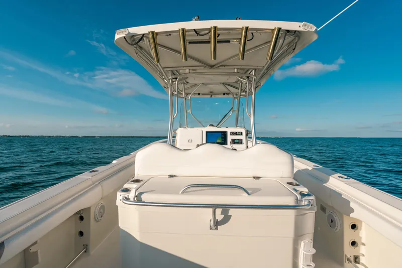 Slide: The Image of 2005 Hydra-Sports 3300 CC boat on open water under clear blue sky. - 27