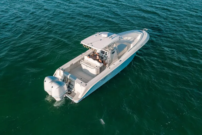 Slide: The Image of 2005 Hydra-Sports 3300 CC boat cruising on open water, aerial view. - 3