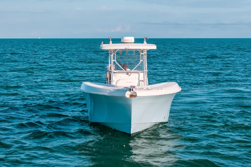 Slide: The Image of 2005 Hydra-Sports 3300 CC boat cruising on open ocean waters. - 4