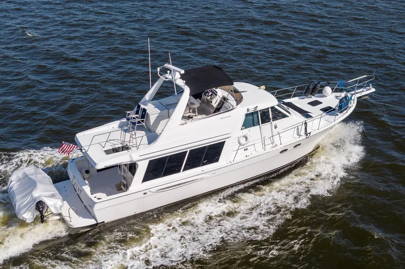 The Image of 2007 Meridian 490 Pilothouse yacht cruising on open water. - 0