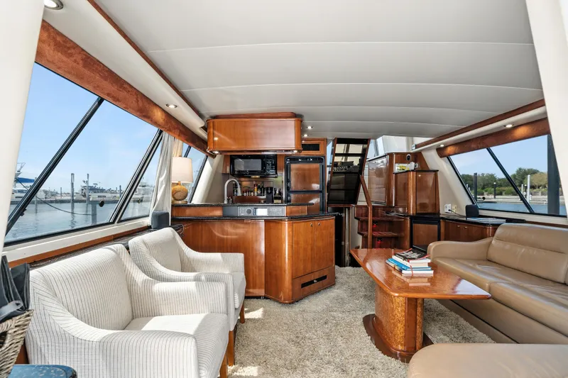Slide: The Image of Luxurious interior of 2007 Meridian 490 Pilothouse yacht with elegant seating and modern amenities. - 10