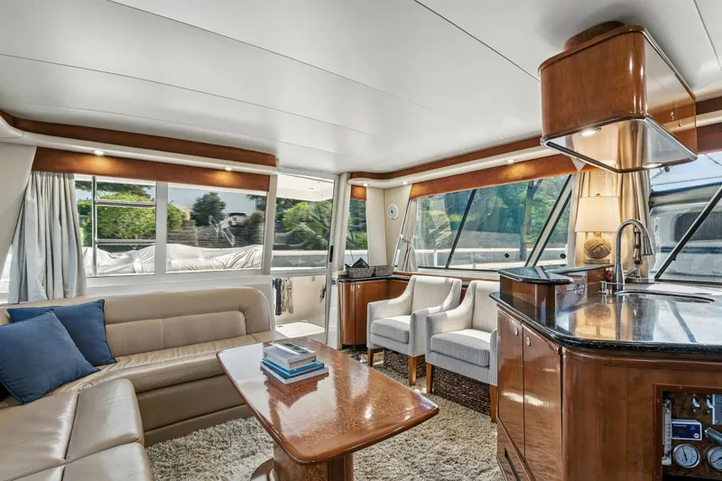 Slide: The Image of Luxurious interior of 2007 Meridian 490 Pilothouse yacht with elegant seating and modern amenities. - 14