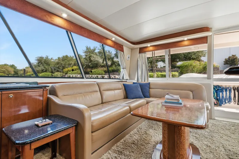 Slide: The Image of Luxurious interior of 2007 Meridian 490 Pilothouse yacht with leather seating and large windows. - 15