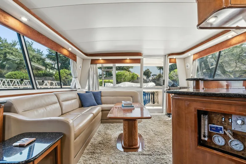 Slide: The Image of Luxurious interior of 2007 Meridian 490 Pilothouse yacht with plush seating and elegant wood finishes. - 18