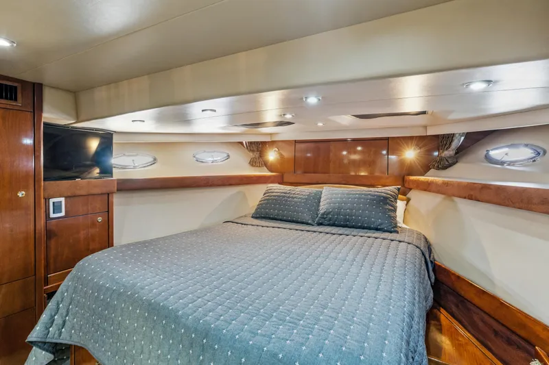Slide: The Image of Luxurious bedroom interior of 2007 Meridian 490 Pilothouse yacht with cozy bedding. - 27