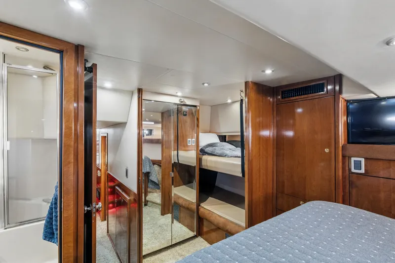 Slide: The Image of Luxurious 2007 Meridian 490 Pilothouse interior with wood finishes and cozy sleeping area. - 30