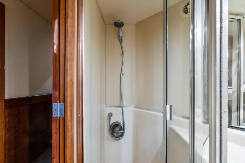 Slide: The Image of Shower area inside 2007 Meridian 490 Pilothouse yacht, featuring glass door and modern fixtures. - 31