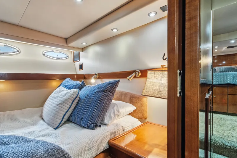 Slide: The Image of Luxurious cabin interior of 2007 Meridian 490 Pilothouse yacht with cozy bedding. - 34