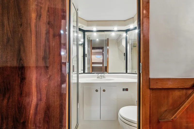 Slide: The Image of Luxurious bathroom in 2007 Meridian 490 Pilothouse yacht with wood accents and modern fixtures. - 36