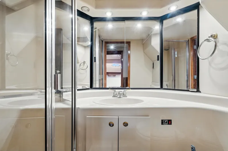Slide: The Image of Luxurious bathroom in 2007 Meridian 490 Pilothouse yacht with modern fixtures and mirrors. - 37