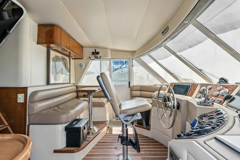Slide: The Image of 2007 Meridian 490 Pilothouse interior with helm, seating, and navigation equipment. - 40