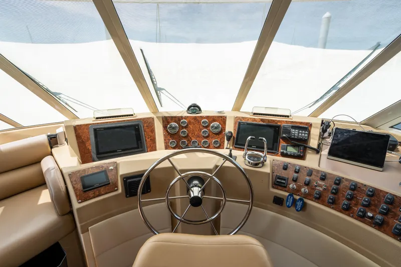Slide: The Image of Pilothouse of 2007 Meridian 490, featuring navigation controls and modern instrumentation. - 42