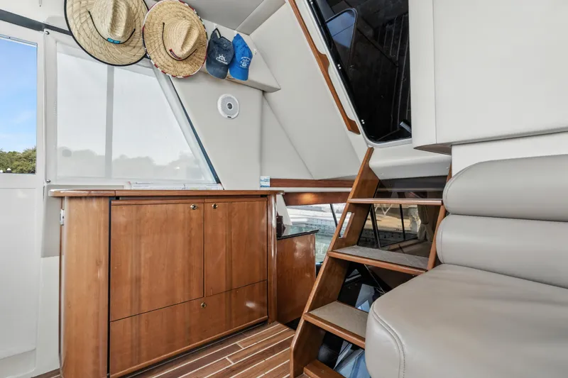Slide: The Image of Interior of 2007 Meridian 490 Pilothouse yacht with wooden cabinetry and stairs. - 43