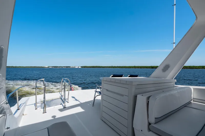 Slide: The Image of 2007 Meridian 490 Pilothouse yacht deck with ocean view and clear blue sky. - 46