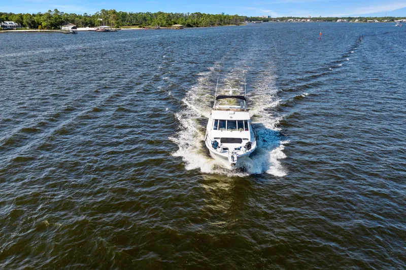 Slide: The Image of 2007 Meridian 490 Pilothouse cruising on a scenic waterway. - 6