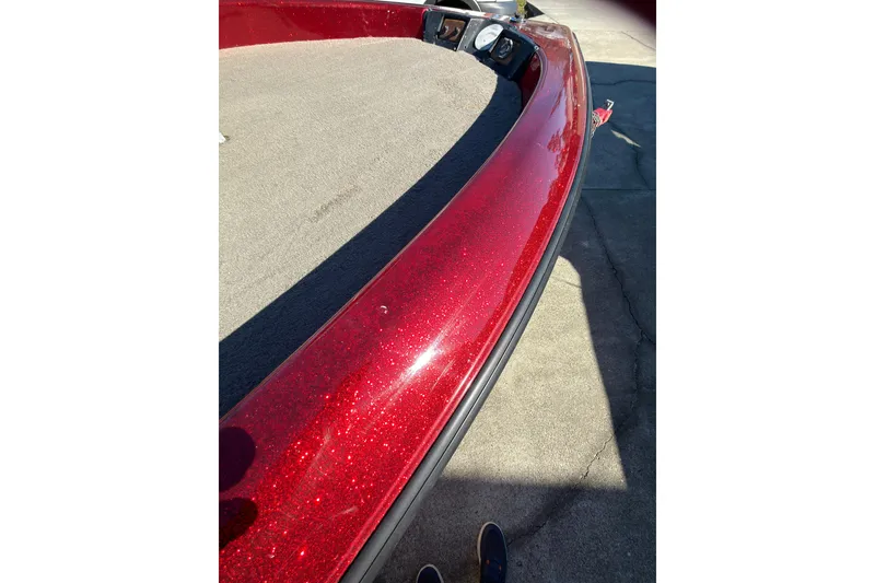 Slide: The Image of Red Fisher F 17 Pro boat, 1998 model, with a sparkling finish on a sunny day. - 11