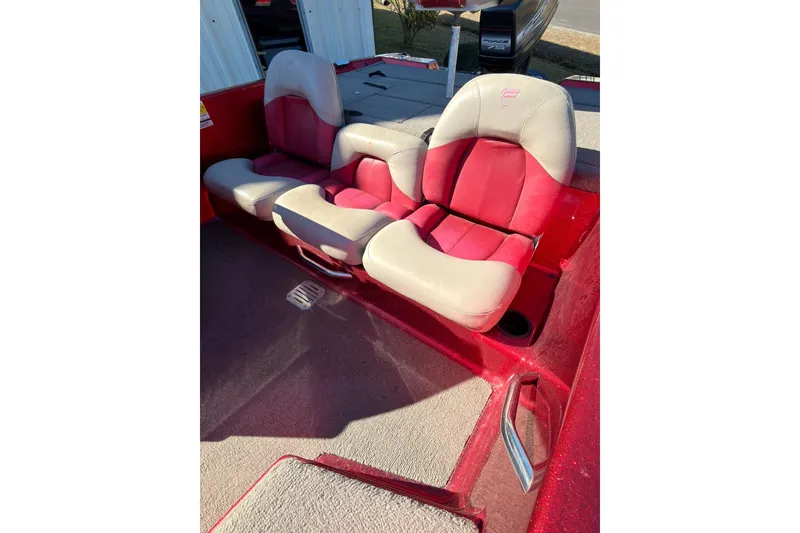 Slide: The Image of Red and beige seats in a 1998 Fisher F 17 Pro boat interior. - 14
