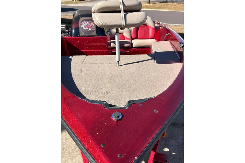 Slide: The Image of 1998 Fisher F 17 Pro boat with red exterior and beige seating. - 16
