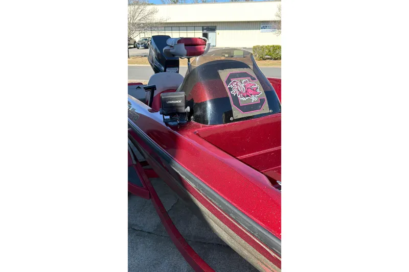 Slide: The Image of Red 1998 Fisher F 17 Pro boat with Lowrance equipment and sports logo on windshield. - 20