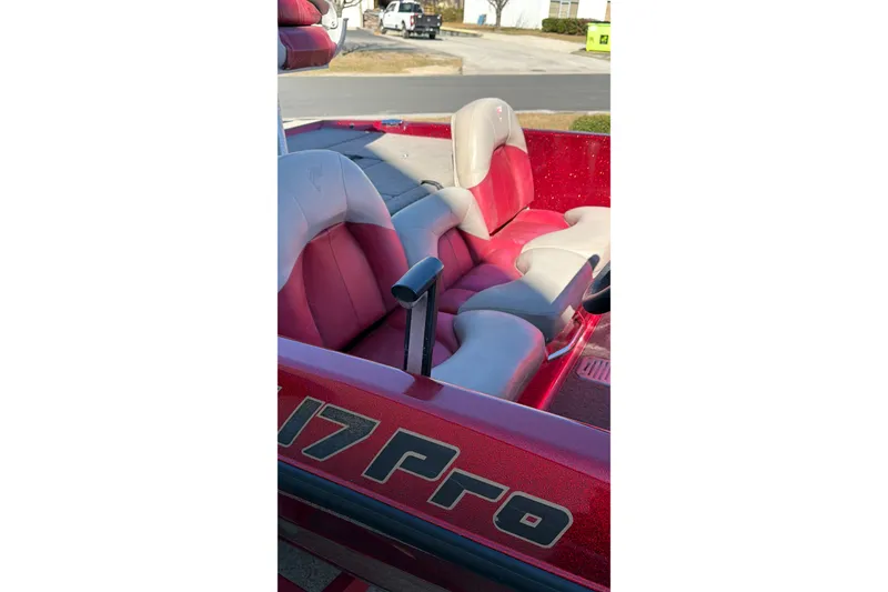 Slide: The Image of Red and gray interior of a 1998 Fisher F 17 Pro boat. - 21