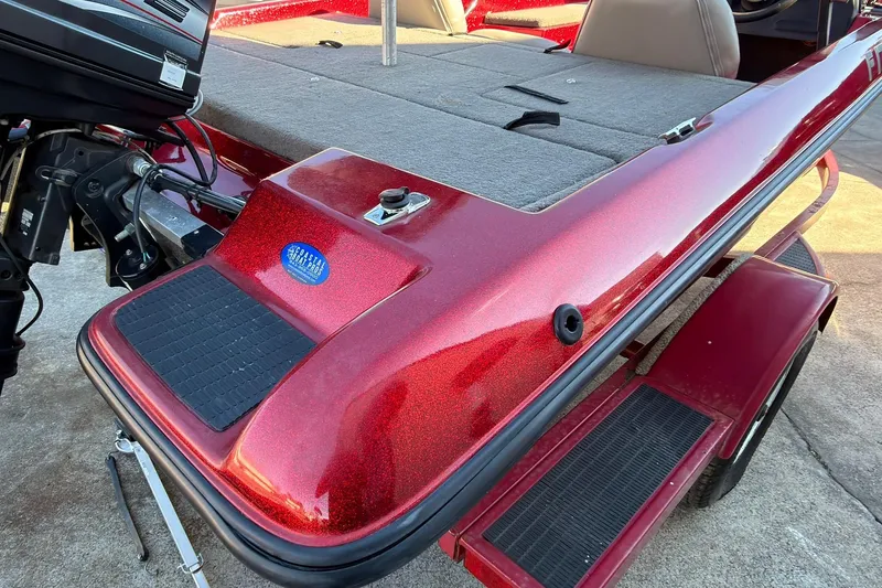 Slide: The Image of Red 1998 Fisher F 17 Pro boat with motor and carpeted deck. - 5