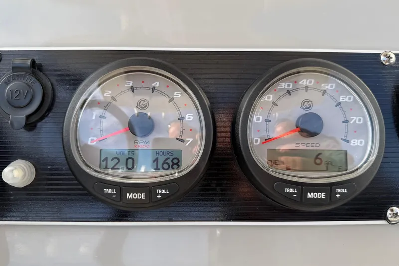 Slide: The Image of Dashboard of a 2017 Boston Whaler 210 Dauntless showing RPM and speed gauges. - 10