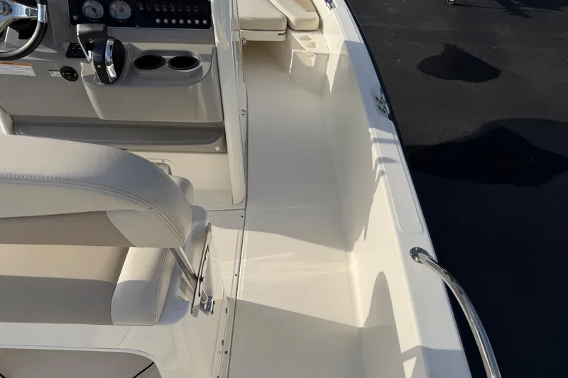 Slide: The Image of Interior view of a 2017 Boston Whaler 210 Dauntless boat cockpit and seating area. - 12