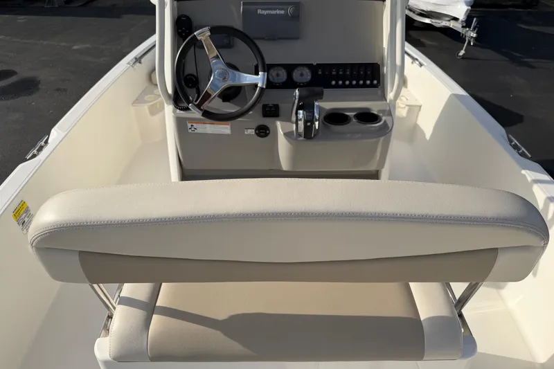 Slide: The Image of 2017 Boston Whaler 210 Dauntless boat interior with steering wheel and control panel. - 13