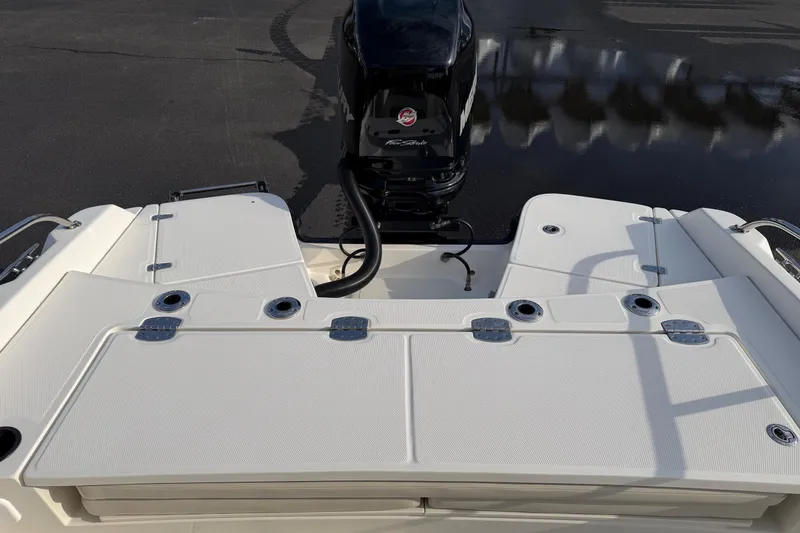 Slide: The Image of 2017 Boston Whaler 210 Dauntless boat deck with engine, showcasing sleek design and functionality. - 14