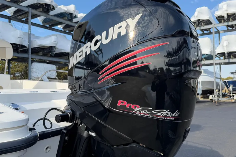 Slide: The Image of Mercury Pro FourStroke engine on 2017 Boston Whaler 210 Dauntless boat, outdoor storage background. - 20