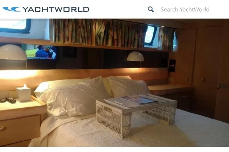 Slide: The Image of 1989 Silverton 46 Aft Cabin yacht interior with cozy bedroom and modern amenities. - 3