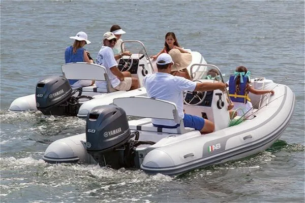 Slide: The Image of 2026 AB Inflatables Oceanus 14 VST with Yamaha 60HP, cruising with passengers on a sunny day. - 8