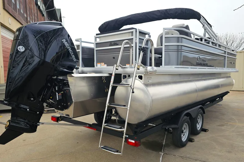 Slide: The Image of 2026 Sun Tracker Fishin' Barge 22 XP3 pontoon boat with Mercury outboard motor. - 3