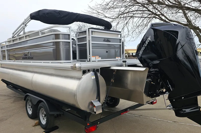 Slide: The Image of 2026 Sun Tracker Fishin' Barge 22 XP3 pontoon boat with Mercury outboard motor. - 7