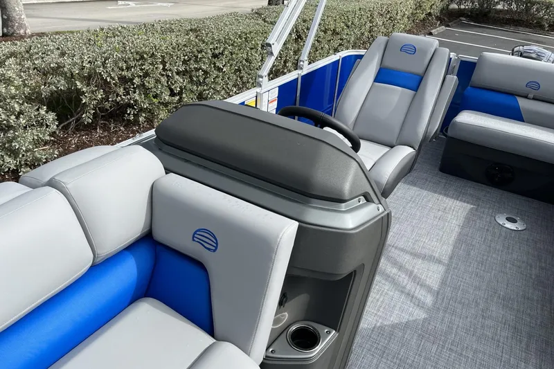 Slide: The Image of 2026 Sun Tracker Party Barge 20 DLX interior with gray and blue seating. - 101